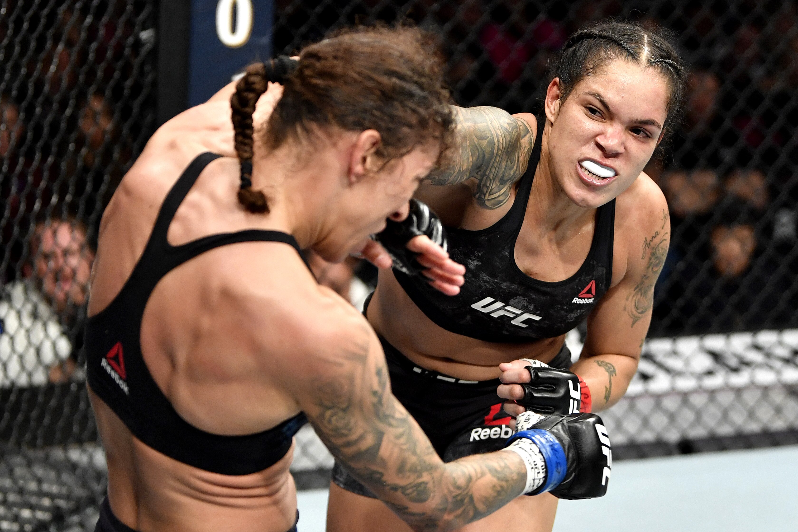 LAS VEGAS, NEVADA - DECEMBER 14: (R-L) Amanda Nunes of Brazil strikes Germaine de Randamie of Netherlands in their UFC women's bantamweight championship bout during the UFC 245 event at T-Mobile Arena on December 14, 2019 in Las Vegas, Nevada. (Photo by Jeff Bottari/Zuffa LLC)