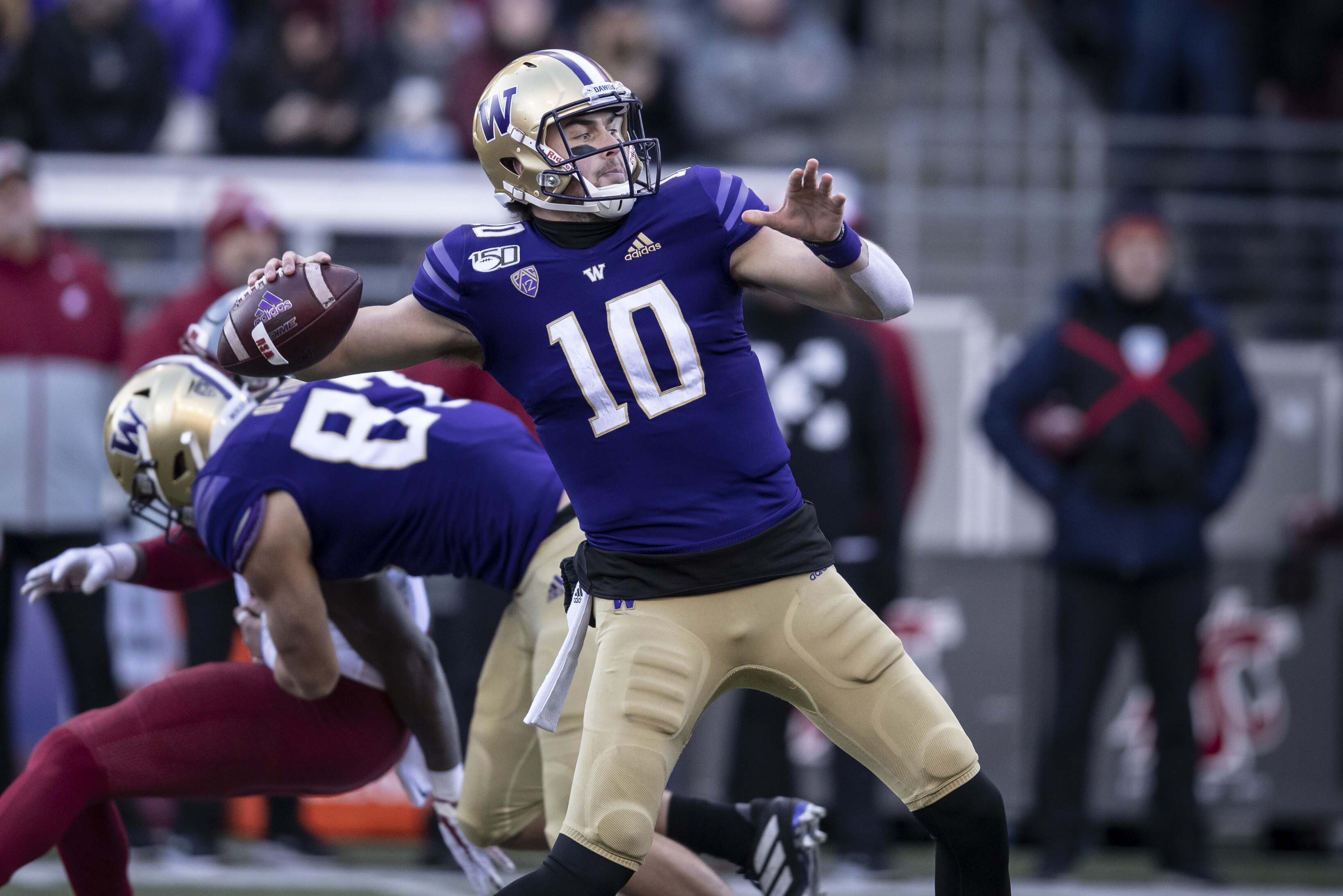 Washington quarterback Jacob Eason passes the ball during the first half of an NCAA college football game against Washington State, on Friday, Nov. 29, 2019 in Seattle. (AP Photo/Stephen Brashear)
