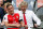Arsenal's French manager Arsene Wenger (R) and Arsenal's German midfielder Mesut Ozil smile as Arsenal players celebrate their victory over Chelsea in the English FA Cup final football match between Arsenal and Chelsea at Wembley stadium in London on May 27, 2017.
Aaron Ramsey scored a 79th-minute header to earn Arsenal a stunning 2-1 win over Double-chasing Chelsea on Saturday and deliver embattled manager Arsene Wenger a record seventh FA Cup. / AFP PHOTO / Adrian DENNIS / NOT FOR MARKETING OR ADVERTISING USE / RESTRICTED TO EDITORIAL USE        (Photo credit should read ADRIAN DENNIS/AFP via Getty Images)