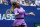 Serena Williams, of the United States, returns a shot to Bianca Andreescu, of Canada, during the women's singles final of the U.S. Open tennis championships Saturday, Sept. 7, 2019, in New York. (AP Photo/Adam Hunger)