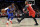 New York Knicks guard Frank Ntilikina, left, passes the ball around Portland Trail Blazers guard Damian Lillard during the first half of an NBA basketball game in Portland, Ore., Tuesday, Dec. 10, 2019. (AP Photo/Steve Dykes)