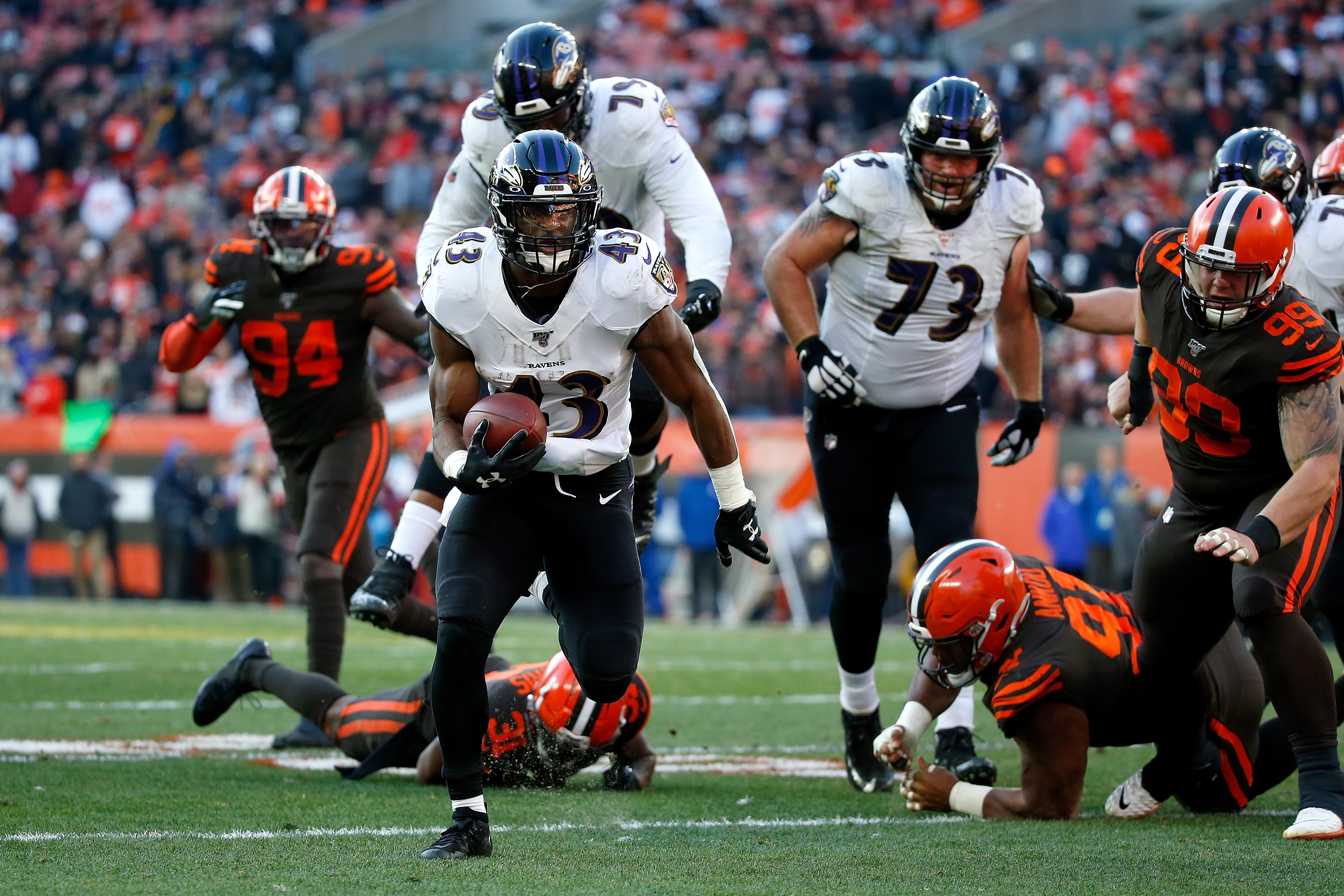 CLEVELAND, OH - DECEMBER 22: Justice Hill #43 of the Baltimore Ravens runs for a touchdown during the fourth quarter of the game against the Cleveland Browns at FirstEnergy Stadium on December 22, 2019 in Cleveland, Ohio. Baltimore defeated Cleveland 31-15. (Photo by Kirk Irwin/Getty Images)