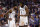 Brooklyn Nets guard Kyrie Irving (11) talks with center DeAndre Jordan (6) during the second half of  the team's NBA basketball game against the Phoenix Suns, Sunday, Nov. 10, 2019, in Phoenix. (AP Photo/Matt York)