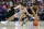 Ohio State's Duane Washington (4) and West Virginia's Taz Sherman (12) battle for a loose ball during the first half of an NCAA college basketball game Sunday, Dec. 29, 2019, in Cleveland. (AP Photo/Ron Schwane)