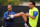 Barcelona FC head coach Josep Guardiola (L) looks on as midfielder Xavi Hernandez streches during a training session at UCLA in Los Angeles on July 30, 2009. Barcelona will face the Los Angeles Galaxy on August 1 in Pasadena, California.  AFP PHOTO / GABRIEL BOUYS (Photo credit should read GABRIEL BOUYS/AFP via Getty Images)