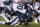 Seattle Seahawks' Jadeveon Clowney (90) hits Philadelphia Eagles' Carson Wentz (11) during the first half of an NFL wild-card playoff football game, Sunday, Jan. 5, 2020, in Philadelphia. Wentz was injured on the play. (AP Photo/Julio Cortez)