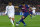 TOPSHOT - Real Madrid's Brazilian midfielder Casemiro (L) challenges Barcelona's Uruguayan forward Luis Suarez during the