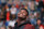 New Orleans Pelicans forward Zion Williamson watches the video screen during a player introduction video before the team's NBA basketball game against the Denver Nuggets in New Orleans, Thursday, Oct. 31, 2019. The rookie first round draft pick is recovering from knee surgery. (AP Photo/Gerald Herbert)