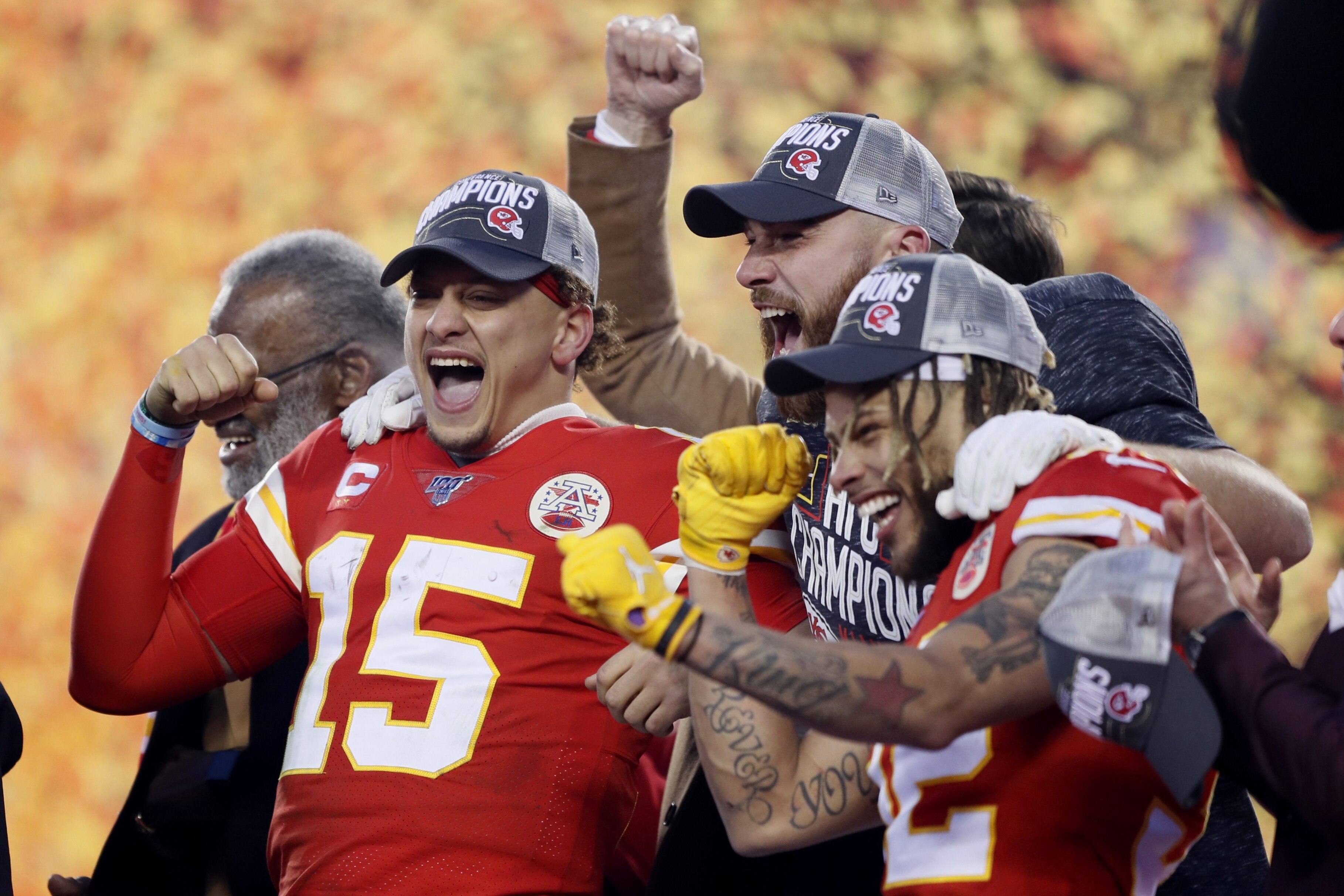 Kansas City Chiefs' Patrick Mahomes (15), Tyrann Mathieu and Travis Kelce celebrate after the NFL AFC Championship football game against the Tennessee Titans Sunday, Jan. 19, 2020, in Kansas City, MO. The Chiefs won 35-24 to advance to Super Bowl 54. (AP Photo/Charlie Neibergall)