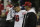San Francisco 49ers quarterback Jimmy Garoppolo wipes down as head coach Kyle Shanahan looks on before an NFL football game against the Seattle Seahawks, Sunday, Dec. 29, 2019, in Seattle. (AP Photo/Stephen Brashear)