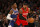 NEW YORK, NEW YORK - JANUARY 01:  (NEW YORK DAILIES OUT)   Carmelo Anthony #00 of the Portland Trail Blazers in action against RJ Barrett #9 of the New York Knicks at Madison Square Garden on January 01, 2020 in New York City. The Knicks defeated the Trail Blazers 117-93. NOTE TO USER: User expressly acknowledges and agrees that, by downloading and or using this photograph, user is consenting to the terms and conditions of the Getty Images License Agreement. (Photo by Jim McIsaac/Getty Images)