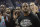 Teammates applaud during a video tribute to Miami Heat guard Andre Iguodala, foreground, before an NBA basketball game between the Golden State Warriors and the Heat in San Francisco, Monday, Feb. 10, 2020. (AP Photo/Jeff Chiu)