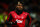 MANCHESTER, ENGLAND - DECEMBER 26: Paul Pogba of Manchester United wearing his personalised wrist bands against racism during the Premier League match between Manchester United and Newcastle United at Old Trafford on December 26, 2019 in Manchester, United Kingdom. (Photo by Robbie Jay Barratt - AMA/Getty Images)