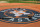 Baseball bats and gloves sit on the tarp with the new Houston Astros logo during batting practice before an exhibition baseball game against the Chicago Cubs Friday, March 29, 2013, in Houston. (AP Photo/Pat Sullivan)