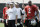 ** FILE ** In this July 24, 2008 file photo, Oakland Raiders head coach Lane Kiffin, second from left, quarterbacks Marques Tuiasosopo, left, and JaMarcus Russell (2) watch from the sidelines during workouts at their football training camp in Napa, Calif. The focus of the third exhibition game against the Arizona Cardinals on Saturday night, Aug. 23, 2008, will be on what Russell and the receivers can do through the air. (AP Photo/Eric Risberg,file)