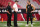 GLENDALE, ARIZONA - AUGUST 15:  (L-R) Head coach Jon Gruden, general manager Mike Mayock and quarterback Derek Carr #4 of the Oakland Raiders talk on the field before the NFL preseason game against the Arizona Cardinals at State Farm Stadium on August 15, 2019 in Glendale, Arizona. (Photo by Christian Petersen/Getty Images)