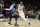 San Antonio Spurs forward DeMar DeRozan (10) drives around Dallas Mavericks guard Seth Curry (30) during the second half of an NBA basketball game in San Antonio, Wednesday, Feb. 26, 2020. (AP Photo/Eric Gay)