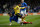 Portsmouth's English defender James Bolton (L) challenges Arsenal's Uruguayan midfielder Lucas Torreira (R) resulting in an injury for Torreira during the English FA Cup fifth round football match between Portsmouth and Arsenal at Fratton Park stadium in Portsmouth, southern England, on March 2, 2020. (Photo by Adrian DENNIS / AFP) / RESTRICTED TO EDITORIAL USE. No use with unauthorized audio, video, data, fixture lists, club/league logos or 'live' services. Online in-match use limited to 120 images. An additional 40 images may be used in extra time. No video emulation. Social media in-match use limited to 120 images. An additional 40 images may be used in extra time. No use in betting publications, games or single club/league/player publications. /  (Photo by ADRIAN DENNIS/AFP via Getty Images)