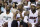 Miami Heat guard Dwyane Wade, left, center Chris Bosh and forward LeBron James sit on the bench during the first half of an NBA basketball game against the Boston Celtics, Friday, April 12, 2013, in Miami. (AP Photo/Wilfredo Lee)
