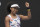 Japan's Naomi Osaka celebrates after defeating Marie Bouzkova of the Czech Republic in their first round singles match the Australian Open tennis championship in Melbourne, Australia, Monday, Jan. 20, 2020. (AP Photo/Lee Jin-man)