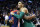 Boston Celtics' Jayson Tatum (0) hugs Washington Wizards' Bradley Beal (3) following an NBA basketball game in Boston, Monday, Dec. 25, 2017. The Wizards won 111-103. (AP Photo/Michael Dwyer)
