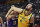 Andrew Bogut of Australia battles for a rebound with Eloy Vargas of the Dominican Republic during their second round basketball game in the FIBA Basketball World Cup in Nanjing in eastern China's Jiangsu province, Saturday, Sept. 7, 2019. (AP Photo)