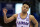 FILE - In this March 4, 2020, file photo, Kansas guard Devon Dotson celebrates a 3-point basket during the second half of the team's NCAA college basketball game against TCU in Lawrence, Kan. Dotson is entering the NBA draft after leading the Big 12 Conference in scoring his sophomore season. “In basketball, this has always been my ultimate dream and my time at KU has prepared me,” Dotson said Monday, April 13, 2020, in a news release.(AP Photo/Orlin Wagner, File)