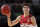 FILE - In this Nov. 17, 2019, file photo, LaMelo Ball of the Illawarra Hawks carries the ball up during their game against the Sydney Kings in the Australian Basketball League in Sydney.  LaMelo Ball's bone bruise on his left foot is expected to keep him out of the Illawarra Hawks lineup for the remainder of the National Basketball League season in Australia. The 18-year-old American, who joined Illawarra as part of the NBL's Next Stars program, is expected to be a first-round pick in this year's NBA draft.(AP Photo/Rick Rycroft, File)