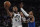 Utah Jazz guard Donovan Mitchell (45) shoots next to New York Knicks guard Elfrid Payton during the second half of an NBA basketball game in New York, Wednesday, March 4, 2020. (AP Photo/Sarah Stier)
