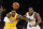 Los Angeles Lakers' LeBron James (23) and Los Angeles Clippers' Kawhi Leonard (2) chase the ball during an NBA basketball game between Los Angeles Lakers and Los Angeles Clippers, Wednesday, Dec. 25, 2019, in Los Angeles. The Clippers won 111-106. (AP Photo/Ringo H.W. Chiu)