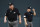 Umpire Joe West, left, walks past umpire Doug Eddings during a baseball game between the Baltimore Orioles and the Toronto Blue Jays, Monday, Aug. 27, 2018, in Baltimore. (AP Photo/Patrick Semansky)