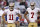 San Francisco 49ers' Alex Smith (11) and Colin Kaepernick (7) wait for the start of passing drills prior to an NFL football game against the Arizona Cardinals Monday, Oct. 29, 2012, in Glendale, Ariz.  The 49ers defeated the Cardinals 24-3.(AP Photo/Ross D. Franklin)