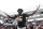 FILE - In this Sept. 21, 2019, file photo, Miami defensive lineman Gregory Rousseau (15) celebrates a turnover and wears the turnover chain during the first half of an NCAA college football game against Central Michigan, in Miami Gardens, Fla. Rousseau was selected to The Associated Press All-Atlantic Coast Conference football team, Tuesday, Dec. 10, 2019. (AP Photo/Brynn Anderson, File)
