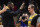 Los Angeles Lakers forward LeBron James, left, congratulates guard Alex Caruso after the Lakers defeated the Los Angeles Clippers 122-117 in an NBA basketball game Friday, April 5, 2019, in Los Angeles. (AP Photo/Mark J. Terrill)