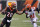 Cincinnati Bengals running back Joe Mixon (28) rushes against Cleveland Browns cornerback Denzel Ward (21) during the first half of an NFL football game, Sunday, Dec. 29, 2019, in Cincinnati. (AP Photo/Bryan Woolston)