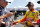 Matt Kenseth signs an autograph after a NASCAR Cup Series auto racing practice session at Darlington Raceway, Friday, Aug. 31, 2018, in Darlington, S.C. (AP Photo/Terry Renna)