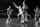 Bill Sharman, Boston Celtics' player, (21), flies through John McCarthy (15) and Bob Pettit (9) rear, both of St. Louis Hawks, as he attempts to score during the first period of the second game of the NBA Playoffs at the Boston Garden, March 29, 1960. (AP Photo)