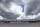 Clouds begin to gather over the grandstand at Turn 1 before a NASCAR Cup Series auto race Sunday, Sept. 1, 2019, at Darlington Raceway in Darlington, S.C. (AP Photo/Richard Shiro)