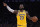 Los Angeles Lakers forward LeBron James gestures to teammates during the second half of an NBA basketball game against the Milwaukee Bucks Friday, March 6, 2020, in Los Angeles. (AP Photo/Mark J. Terrill)