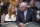 Jeanie Buss, left, Los Angeles Lakers executive vice president of business operations, and former Lakers head coach Phil Jackson sit during the first half of their NBA basketball game against the Dallas Mavericks, Tuesday, April 2, 2013, in Los Angeles. (AP Photo/Mark J. Terrill)