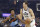 Utah Jazz's Bojan Bogdanovic (44) drives past Cleveland Cavaliers' Collin Sexton (2) in the first half of an NBA basketball game, Monday, March 2, 2020, in Cleveland. (AP Photo/Tony Dejak)