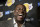 FILE - In this April 9, 2019, file photo, Magic Johnson speaks to reporters prior to an NBA basketball game between the Los Angeles Lakers and the Portland Trail Blazer in Los Angeles. Johnson might actually miss the Lakers if he was not always checking up on them. Johnson quit as the team's president of basketball operations at the end of the last season, leaving him out of a gym, but not out of the loop, as Los Angeles opened training camp. (AP Photo/Mark J. Terrill, File)