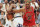 SALT LAKE CITY, UNITED STATES:  Dennis Rodman (R) of the Chicago Bulls gets his arm caught by Karl Malone (L) of the Utah Jazz 14 June as Rodman tries for the ball during game six of the NBA Finals at the Delta Center in Salt Lake City, UT. The Bulls won the game 87-86 to win their sixth NBA Championship.   AFP PHOTO/Jeff HAYNES (Photo credit should read JEFF HAYNES/AFP via Getty Images)