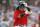 Boston Red Sox left fielder Manny Ramirez removes his helmet after flying out to end the seventh inning of a baseball game against the New York Yankees at Fenway Park in Boston, Saturday July 26, 2008. (AP Photo/Elise Amendola)