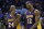 Los Angeles Lakers guard Kobe Bryant (24) and center Dwight Howard (12) walk off the court during a time out in the fourth quarter of an NBA basketball game against the Oklahoma City Thunder in Oklahoma City, Friday, Dec. 7, 2012. Oklahoma City won 114-108.(AP Photo/Sue Ogrocki)