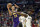 Los Angeles Lakers guard Danny Green (14) goes up for a basket as New Orleans Pelicans forward Zion Williamson (1) defends in the first half of an NBA basketball game in New Orleans, Sunday, March 1, 2020. (AP Photo/Rusty Costanza)