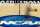 FILE - In this March 14, 2012, file photo, a player runs across the NCAA logo during practice at the NCAA tournament college basketball in Pittsburgh. The NCAA Board of Governors took the first step Tuesday, Oct. 29, 2019, toward allowing athletes to cash in on their fame, voting unanimously to clear the way for the amateur athletes to