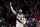 Portland Trail Blazers forward Carmelo Anthony encourages the crowd as they cheer 'MVP, MVP' to guard Damian Lillard, not pictured, during the second half of an NBA basketball game against the Utah Jazz in Portland, Ore., Saturday, Feb. 1, 2020. The Blazers won 124-107. (AP Photo/Steve Dykes)