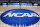 FILE - In this March 18, 2015, file photo, the NCAA logo is displayed at center court as work continues at The Consol Energy Center in Pittsburgh, for the NCAA college basketball tournament. NCAA President Mark Emmert says NCAA Division I basketball tournament games will be played without fans in the arenas because of concerns about the spread of coronavirus. (AP Photo/Keith Srakocic, File)
