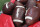Footballs are shown on the Georgis bench during the second half of an NCAA college football game against Arkansas State Saturday, Sept. 14, 2019, in Athens, Ga. (AP Photo/John Bazemore)
